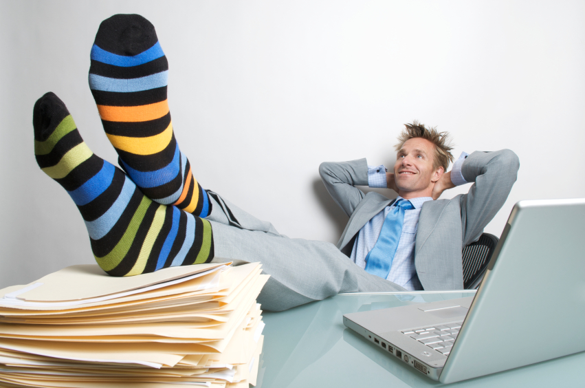 man-relaxing-with-files-and-computer